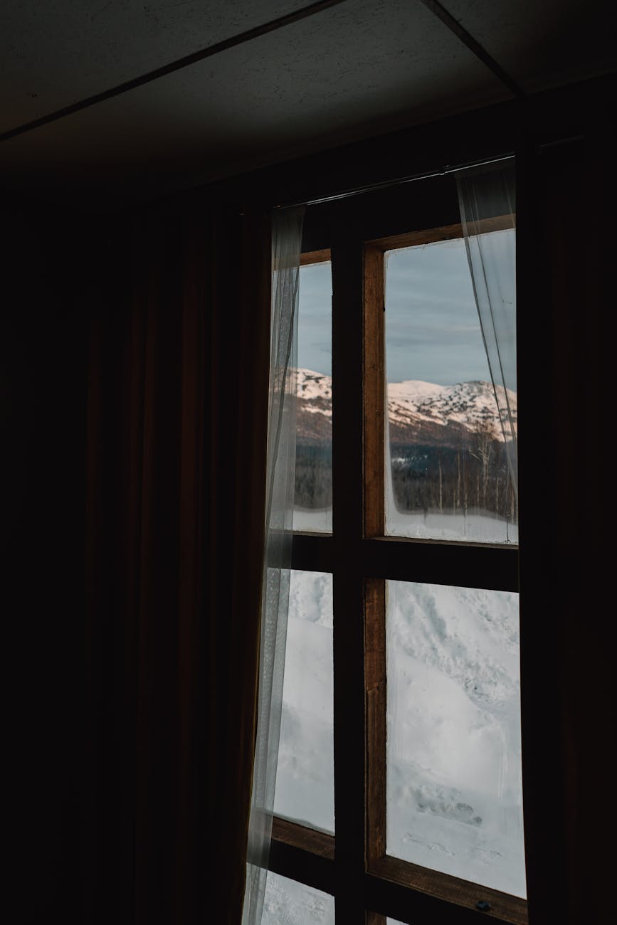 A person smiling peacefully outdoors, suggesting a feeling of well-being and vitality.